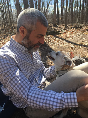 Jonathan Kramnick and one of his four dogs.